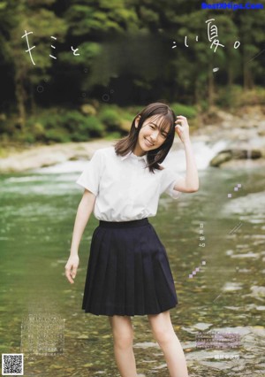 A woman in a school uniform is posing for a magazine.