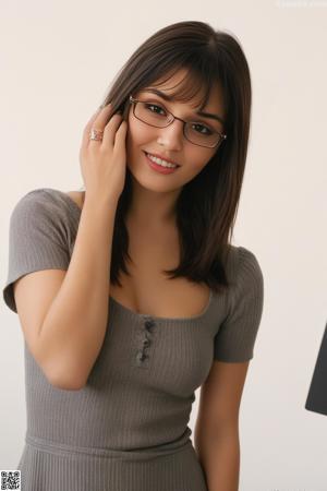 A woman in a white shirt and black skirt posing for a picture.