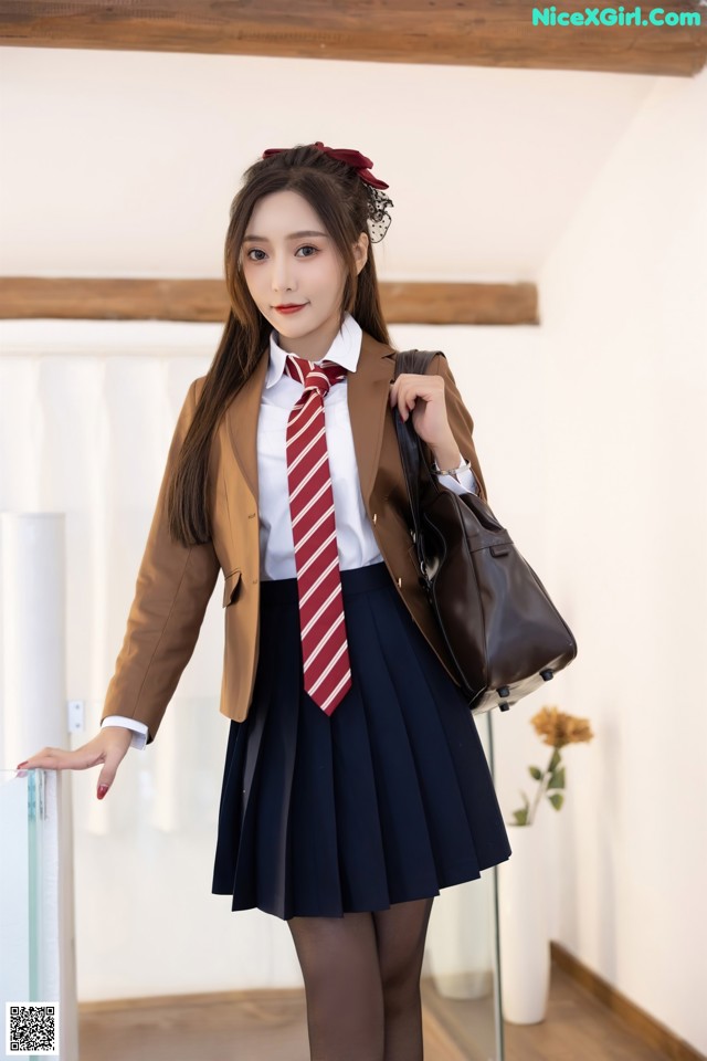 A woman in a school uniform is posing for a picture.