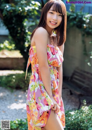 A young woman with a flower crown on her head.