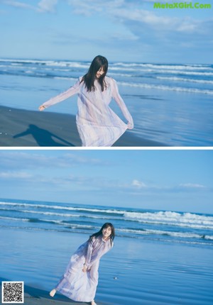 A woman with long black hair standing on a beach.