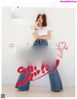 A woman in a white bodysuit and blue jeans is posing for a magazine.