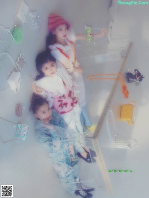 A group of young women standing next to each other.
